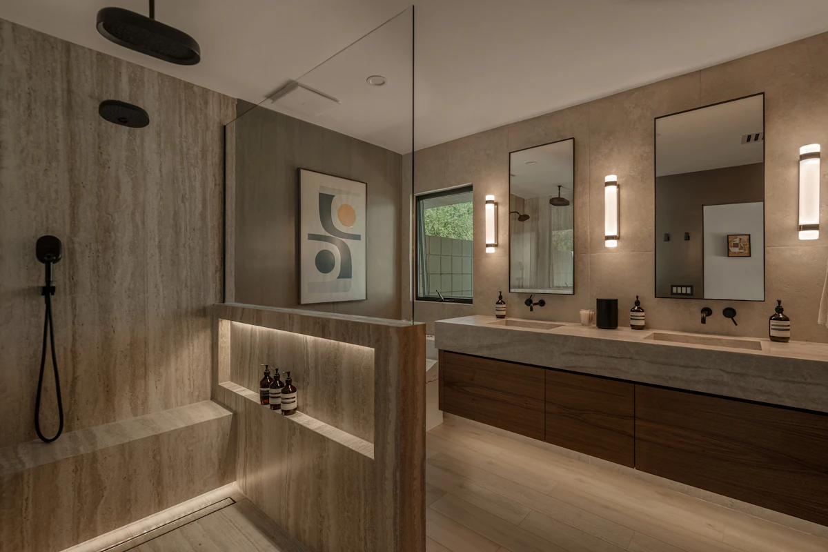 Remodeled bathroom with double vanity and walk-in shower
