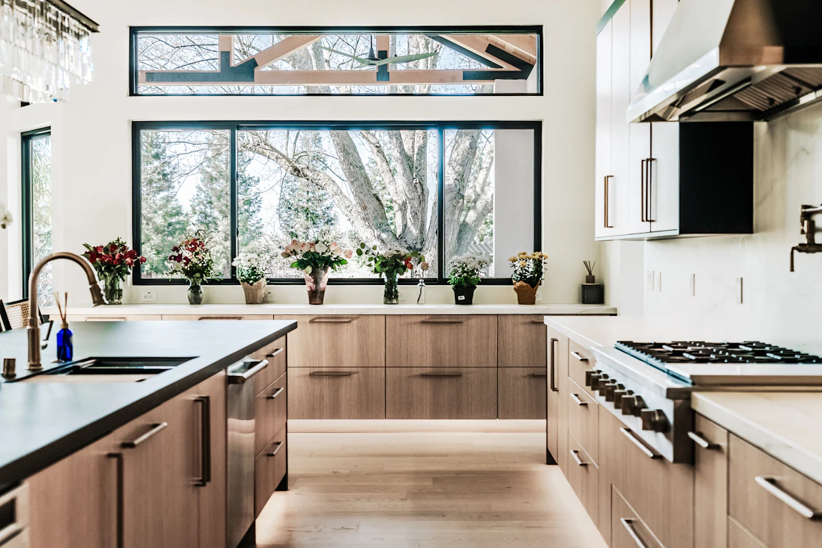 Kitchen with wood cabinets and large windows