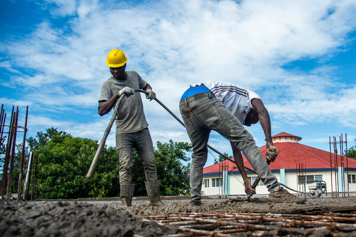 Crew pouring concrete outdoors