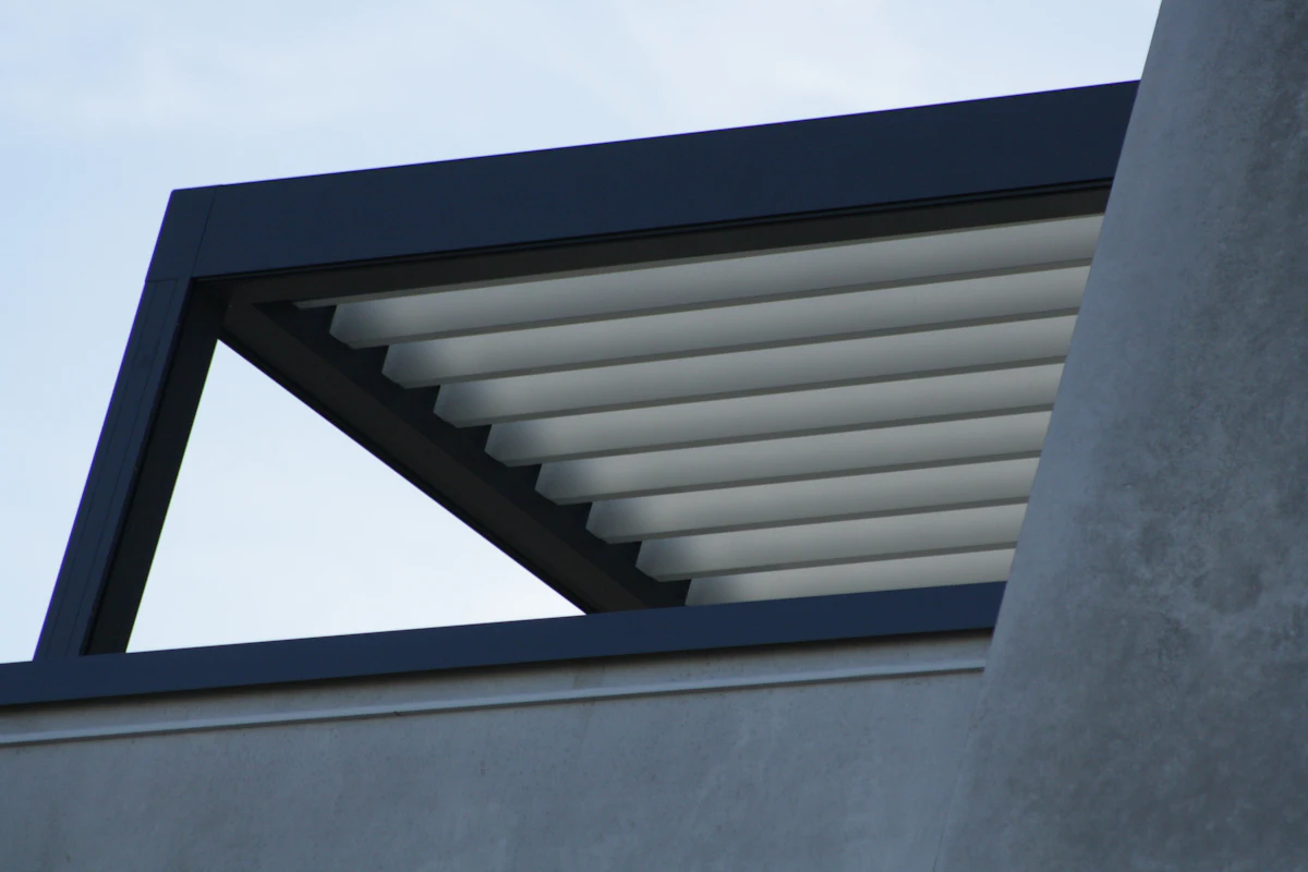 Modern patio cover with adjustable louvers