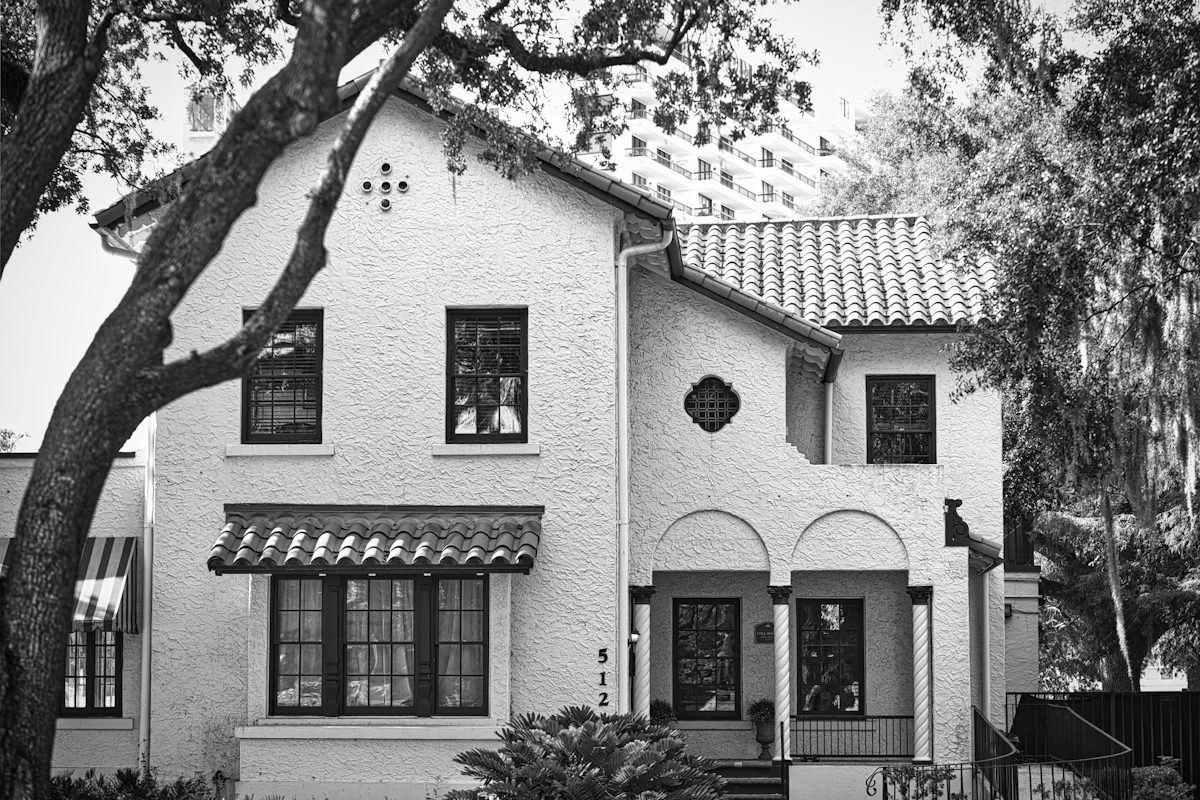 Two-story stucco home with a tile roof